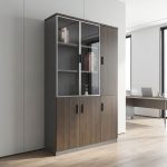 Nairobi Office Mart Wooden Office Cabinet Prices In Kenya 3-Door Wooden Office Cabinet – Stylish, Spacious & Functional Storage Keep your workspace neat and organized with the 3-Door Wooden Office Cabinet. Designed for modern offices, it combines practical storage with a professional appearance. Its wooden finish adds warmth and elegance to your office interior. Therefore, it is an excellent choice for corporate offices, home offices, and business environments. The 3-door office cabinet provides convenient storage for documents, files, stationery, and other office essentials. Its multiple doors help keep your belongings neatly arranged and out of sight. As a result, you can maintain a clean and clutter-free workspace. It is ideal for professionals who need accessible storage for everyday office supplies. Built for practical office organization, this wooden storage cabinet helps maximize available space. You can use it to store files, folders, books, and important paperwork. Furthermore, its versatile design makes it suitable for executive offices, administrative departments, reception areas, and meeting rooms. It also pairs well with executive desks and other wooden office furniture. The wooden office storage cabinet offers a professional look that complements different office layouts. Its three-door design provides a convenient way to organize items according to your needs. Additionally, the cabinet helps keep essential documents in one central location. This makes daily office activities easier and more efficient. Whether you are furnishing a new office or upgrading your existing workspace, the 3-Door Wooden Office Cabinet is a practical addition. Its combination of storage capacity, functionality, and timeless styling makes it suitable for various professional settings. Choose this cabinet to create a more organized and attractive working environment. Key Features Three-Door Design: Provides convenient access to stored office essentials. Spacious Storage: Ideal for files, folders, documents, stationery, and books. Wooden Finish: Adds a classic and professional touch to your office. Organized Workspace: Helps reduce clutter and keeps supplies neatly stored. Versatile Application: Suitable for corporate offices, home offices, and administrative spaces. Professional Appearance: Complements executive desks and other office furniture. Practical Functionality: Keeps everyday office essentials accessible and organized. Improve Your Office Organization Today Choose the 3-Door Wooden Office Cabinet for a practical and stylish storage solution. It helps maintain a tidy workspace while enhancing your office interior. Moreover, its versatile design makes it suitable for businesses of different sizes. Add this wooden office cabinet to your furniture collection and enjoy a more organized, professional working environment.